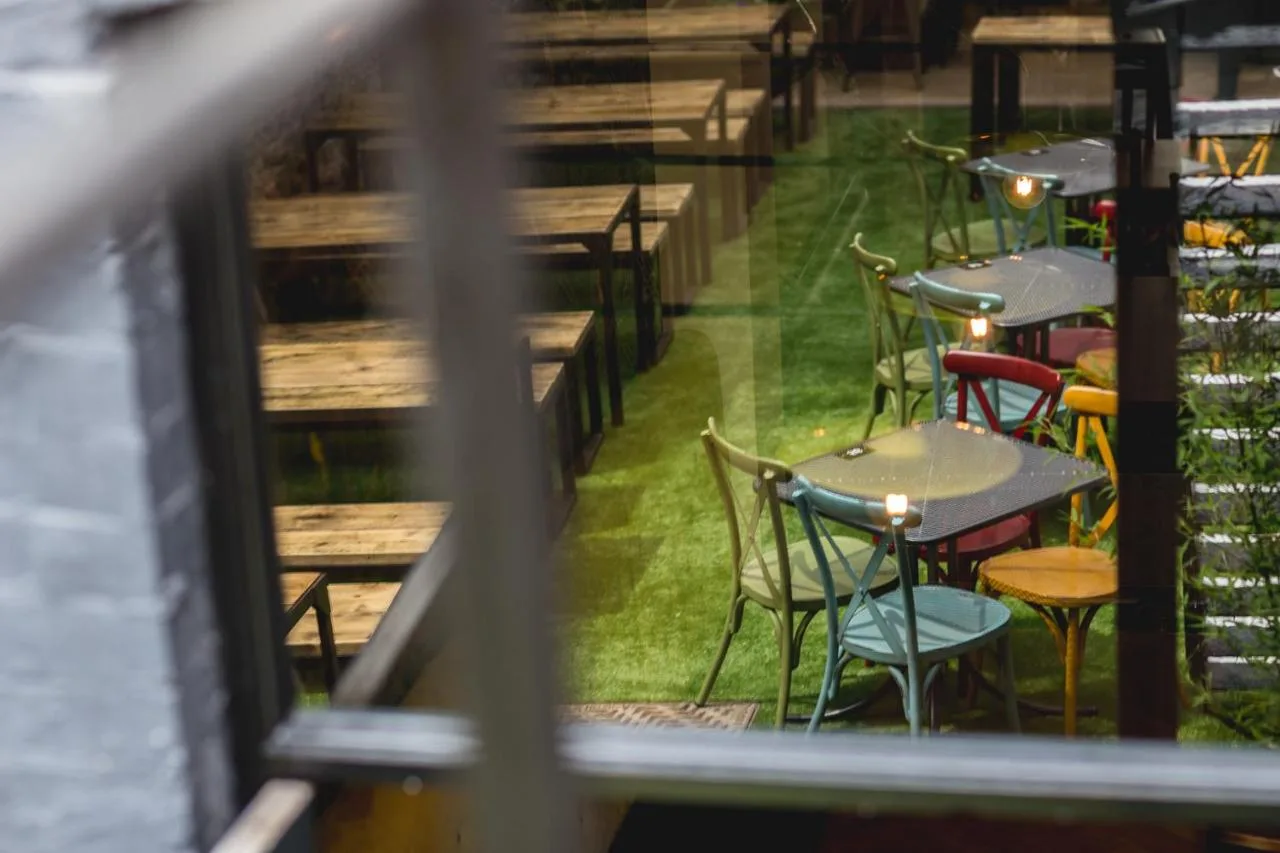 a view of tables and chairs in a restaurant at Pontcanna Inn in Cardiff